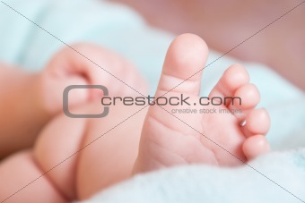 baby\'s foot on blanket