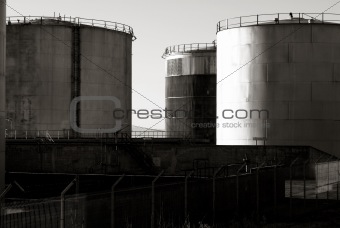 Fence and oil storage tanks