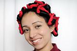 Indian lady with hair curlers.