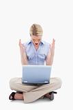 Sitting woman yelling at her laptop