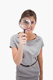 Woman using magnifier