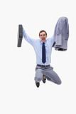 Businessman with suitcase in mid air