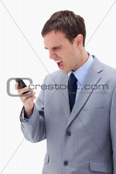 Businessman yelling at his cellphone