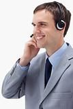 Side view of businessman using headset