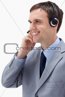 Side view of businessman using headset