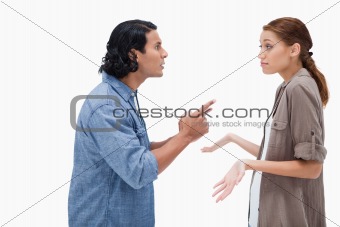 Side view of man asking his clueless girlfriend