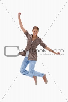 Smiling woman jumping