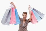 Woman raising her shopping bags