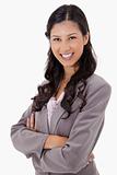Smiling businesswoman with arms folded