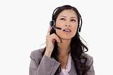 Businesswoman listening to caller with headset