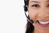 Smiling female call center agent with headset