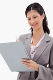 Smiling businesswoman with clipboard