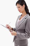 Side view of businesswoman with clipboard