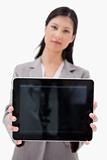 Businesswoman showing tablet screen