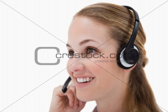 Side view of smiling call center agent 