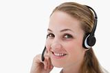 Side view of smiling call center agent with headset
