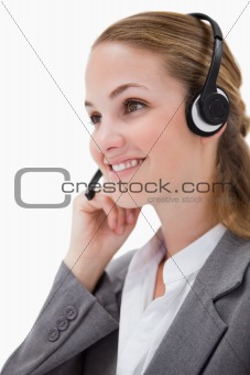 Side view of listening call center agent with headset on