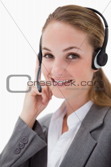 Side view of smiling female call center agent