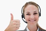 Smiling call center agent giving thumb up