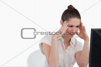 Tired businesswoman using a computer