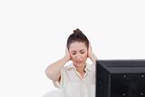 Businesswoman having a headache while using a computer