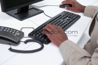 Close up of masculine hands using a computer