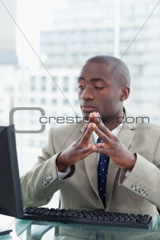 Portrait of a serious office worker using a computer