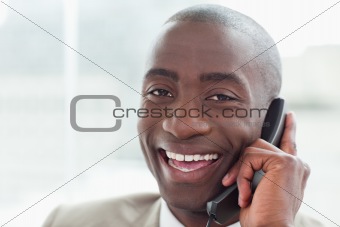 Close up of a cheerful businessman on the phone
