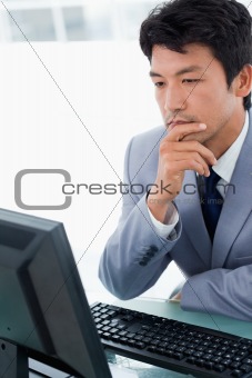Portrait of an office worker using a monitor