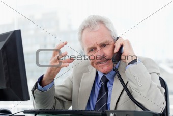 Angry senior manager on the phone
