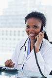Portrait of a female doctor on the phone