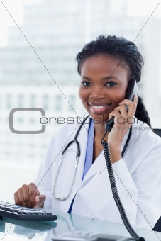 Portrait of a female doctor on the phone