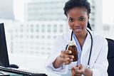 Young female doctor giving medication