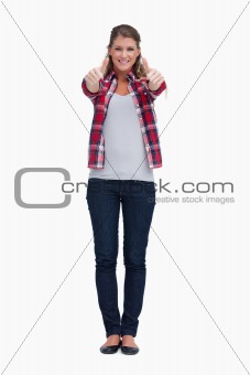 Portrait of a woman with the thumbs up