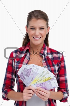 Portrait of a woman holding bank notes