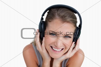 Close up of a happy woman listening to music
