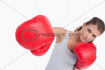 Serious woman boxing