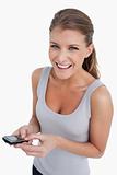 Portrait of a happy woman holding her mobile phone