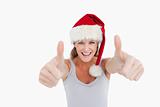 Woman with the thumbs up and a Christmas hat