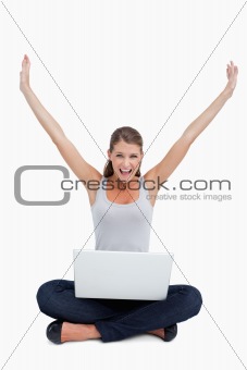 Cheerful woman using a notebook