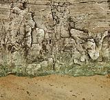 Granite rock on a sandy beach