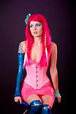 Young woman dressed in bright latex clothes 