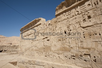 Egyptian hieroglyphic carvings on a temple wall