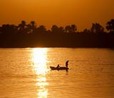 Traditional egyptian fisherman at sunset