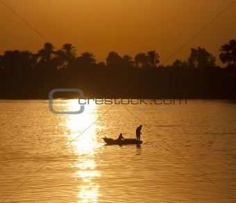 Traditional egyptian fisherman at sunset