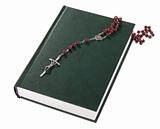rosary on the Bible