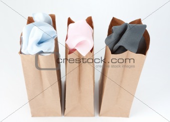 Clothes In Brown Paper Bags