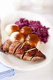 Roast duck breast with potato dumplings and red cabbage