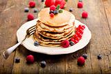 Pancakes on wooden table
