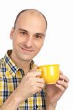 Young man drinking a cup of tea